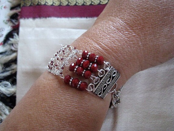 Knitted  wire bracelet in  sterling silver and red