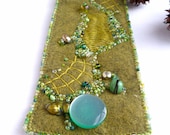 Fragments in green III, fiber art cuff