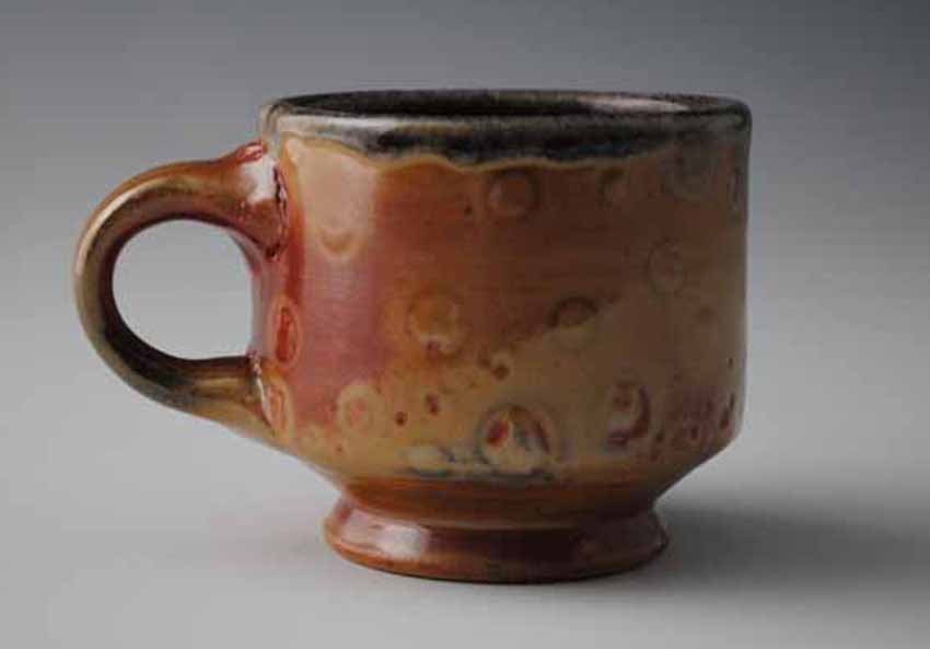 Small Footed Earthy Orange Mug with Pale Spots