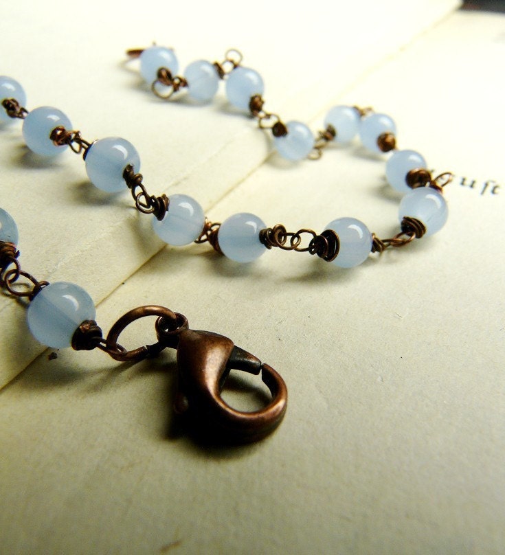 Someone, somewhere, sings about the sky - Hand wrapped copper and glass bracelet