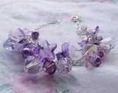 Beaded charm bracelet..purple crystals..flowers