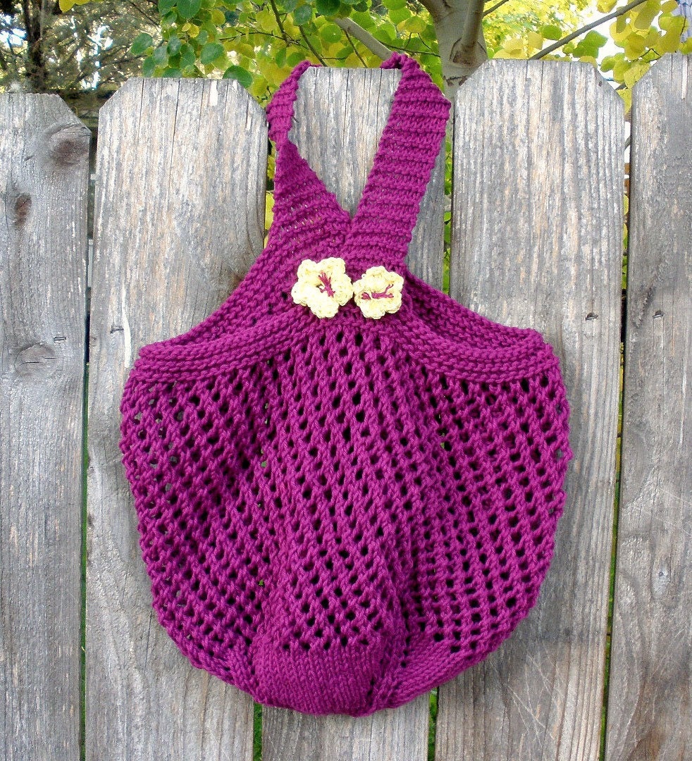 Purple Knitted Market Tote with flowers on handle.