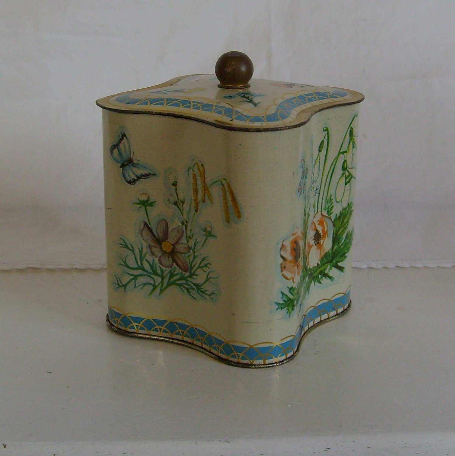 Vintage biscuit tin canister container floral with butterflies blue green and yellow
