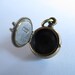 steampunk mourning locket SKULL LOCKET bronze with sterling silver skulls