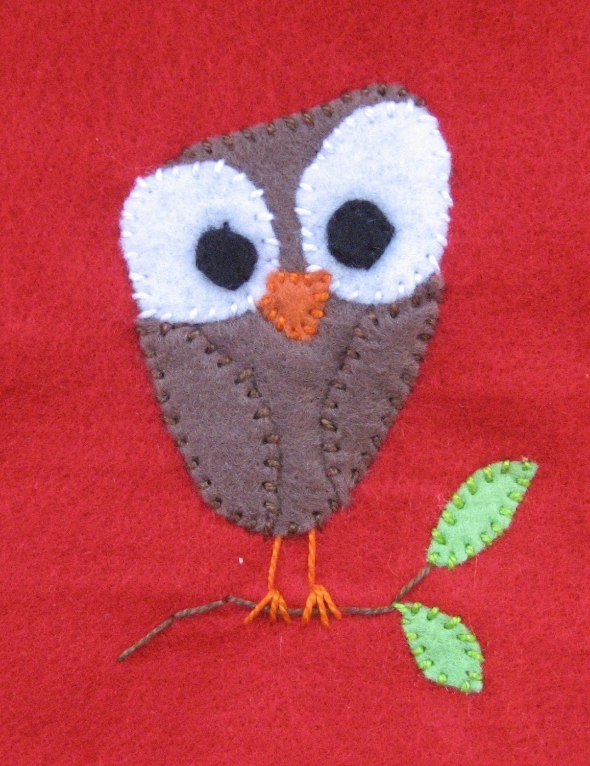 Brown Owl on branch on Red tissue cozy