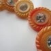 Vintage Buttons - beautiful lot of 7 matching tangerine, lemon mix with rhinestone center (lot 705)