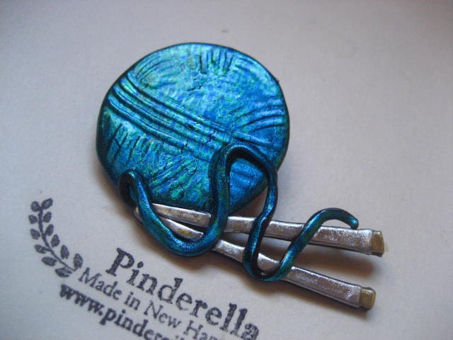 Knitting needles and yarn knitting pin in teal brooch