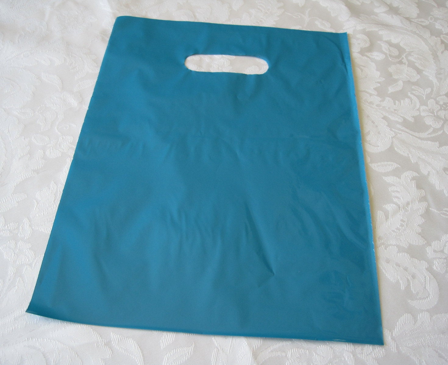 Blue Plastic Merchandise Gift Bags 9 x12  Set of 50