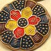 30s Czech glass button, Flower in blue, brown, yellow & red.