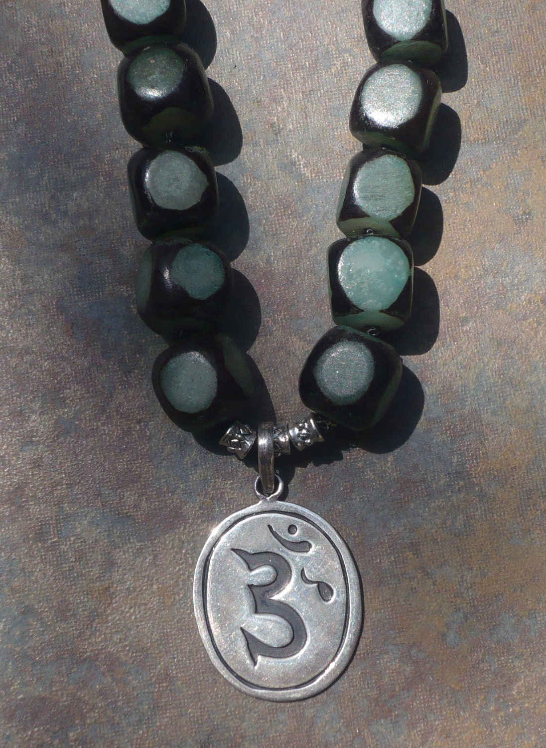 black/teal and silver beads knotted necklace with siver OM pendant