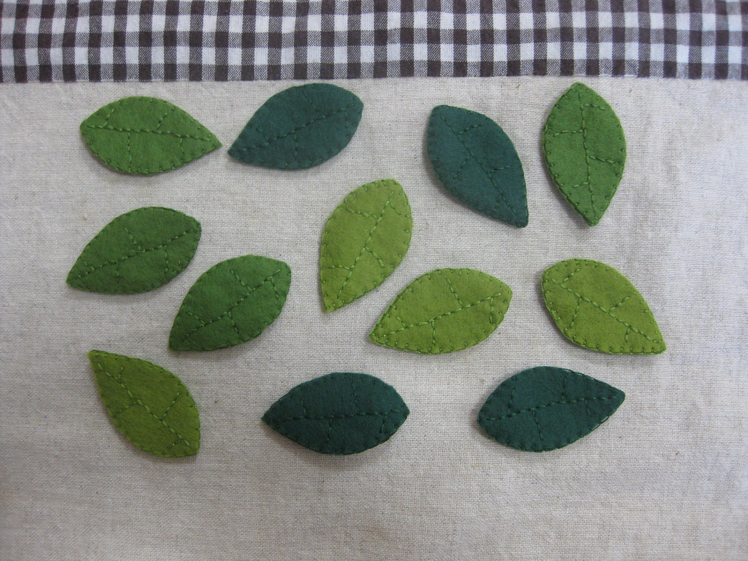 Felt green leaves