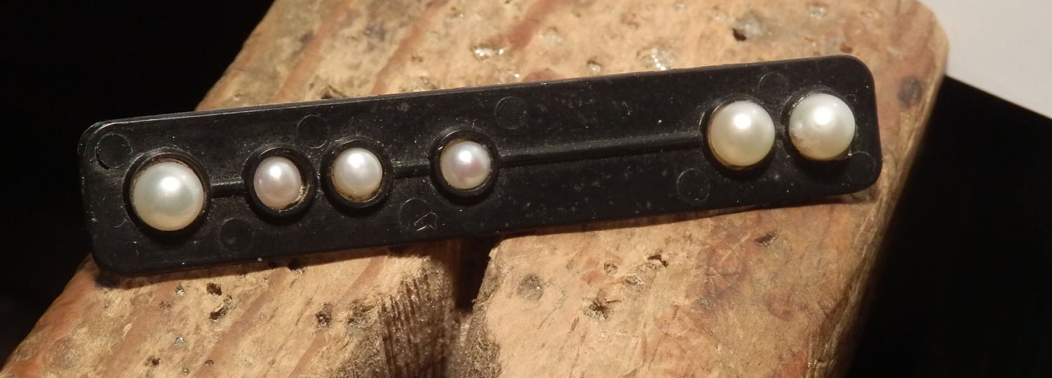 Upcycled black plastic and pearl brooch
