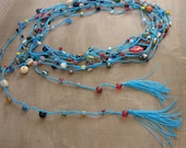5m long festive garland crocheted with colorful glass beads in red, green, or blue