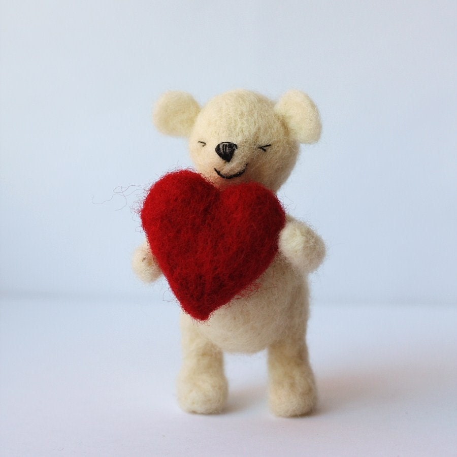 Woolly the shy Ted. Needlefelted white teddy bear with red heart.