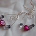Earrings with wire and pink and purple beads