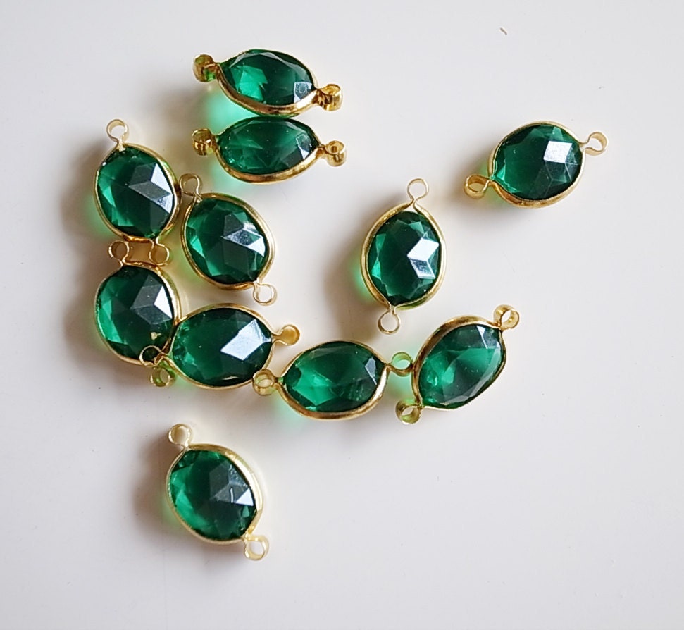 12 Vintage emerald green connector beads lucite with brass frame caged 16mm long with new plating on the metal gold tone