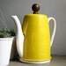 vintage yellow teapot and warmer set