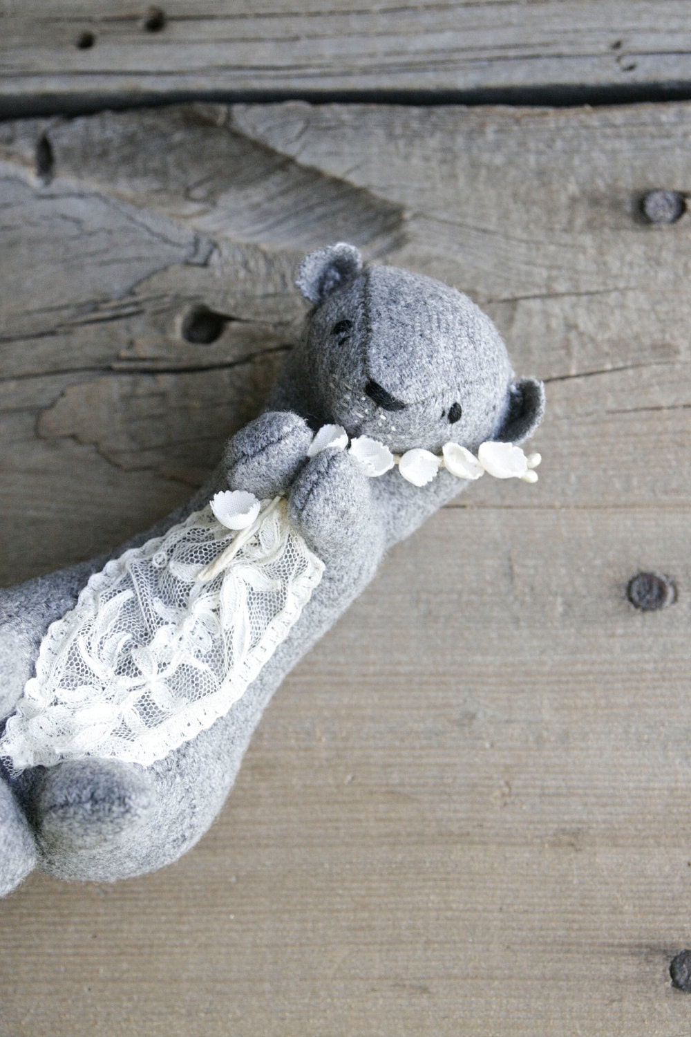 river otter gathering flowers / soft sculpture animal