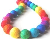Rainbow Revolving - A colourful necklace made from a revolving spectrum of hand felted beads. Free International Shipping