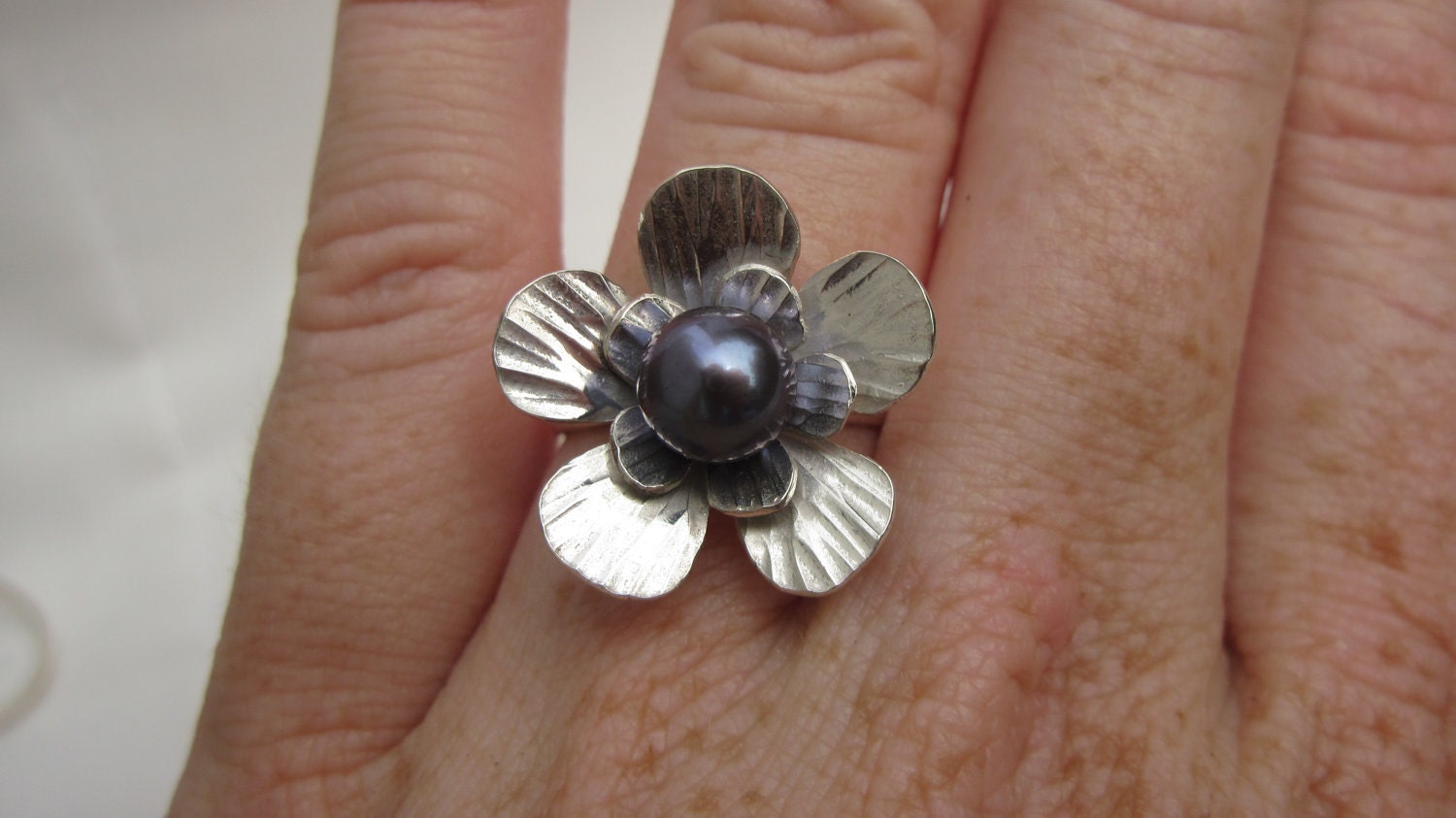 Sterling silver dress ring with large flower and fresh-water pearl