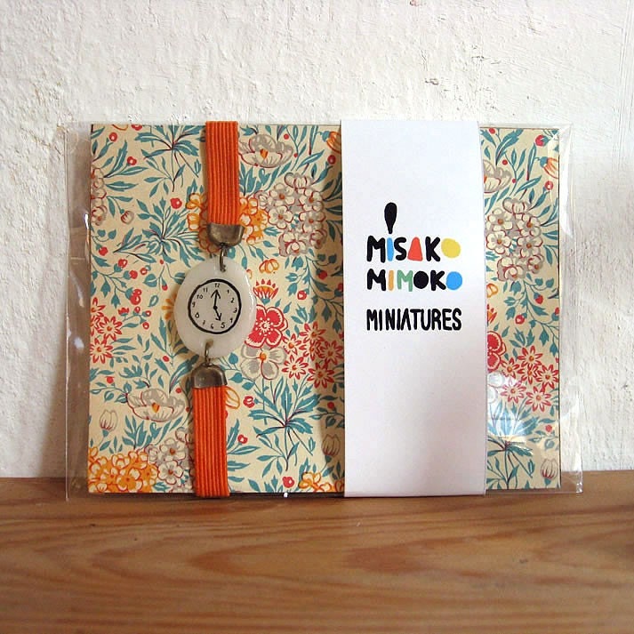 ORANGE Fake watch with elastic watchband bracelet. Porcelain toy clock.