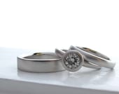Palladium and moissanite engagement ring and wedding band set