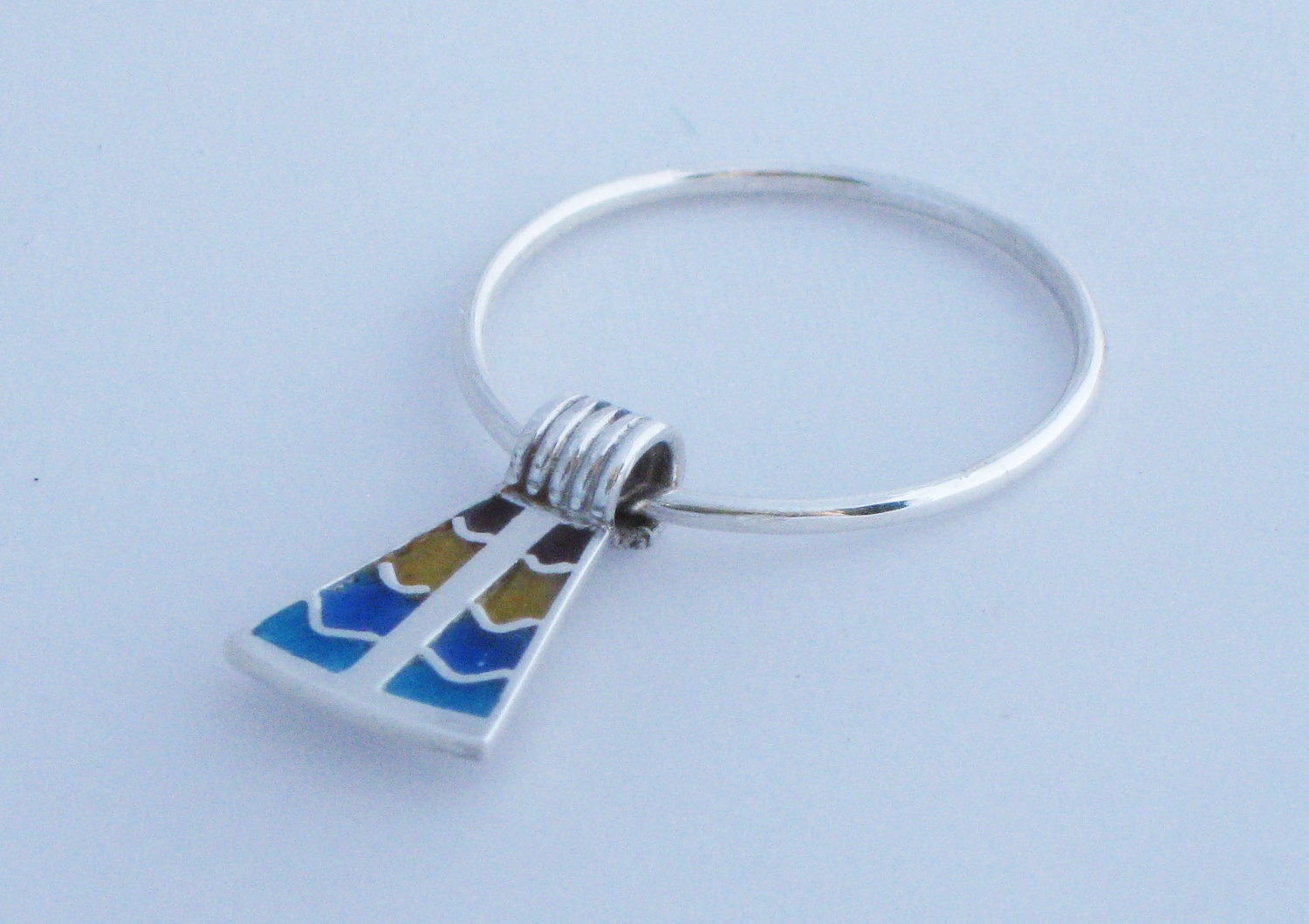Sterling silver charm ring with enamelled Ancient Egyptian inspired motif
