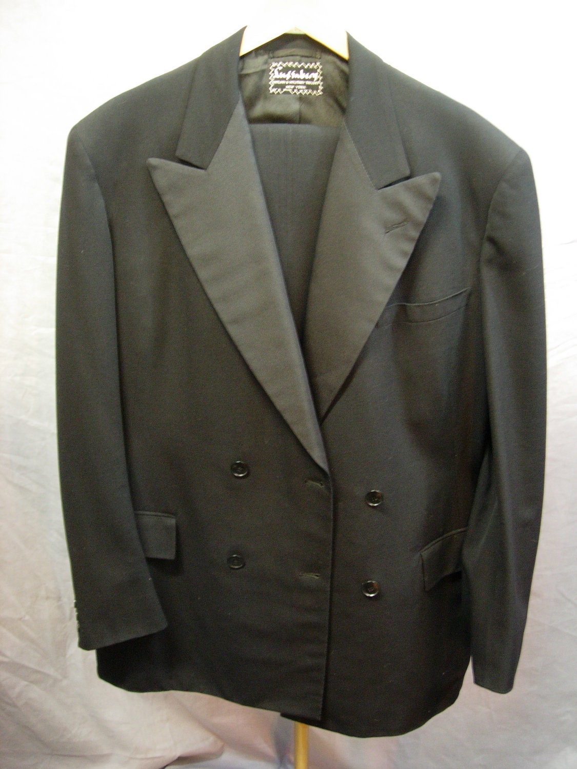 February 1946, Luxemberg black tuxedo. Extra large, tall.