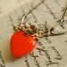 a delicate tattoo (raw brass on orange) - vintage brass flower orange glass heart necklace