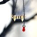 gold vampire fang - swarovski crystal - black necklace