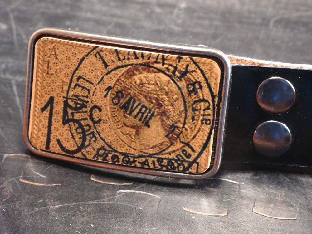 Postal belt buckle on leather