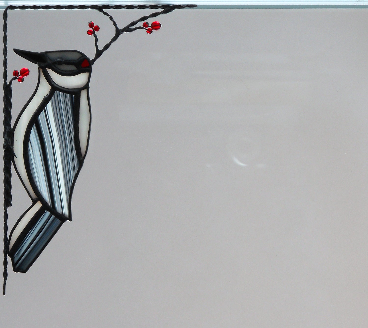 downy woodpecker bird / stained glass window corner
