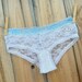 BRIDAL something BLUE panty - dainty lacey white with a splash of something blue with the words I DO in rhinestones size X Large