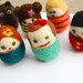 Set of 6 tiny egg people in egg carton and one egg dog