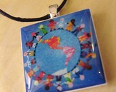 Peaceful Children around the World Pendant on Black Cotton Cording