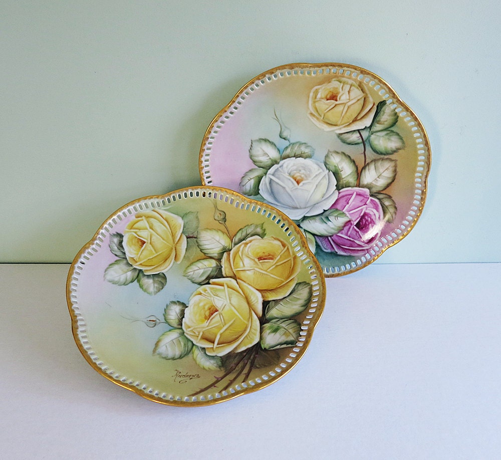 Pair of Signed Hand Painted Porcelain Plates with Cabbage Roses and a Reticulated Edge