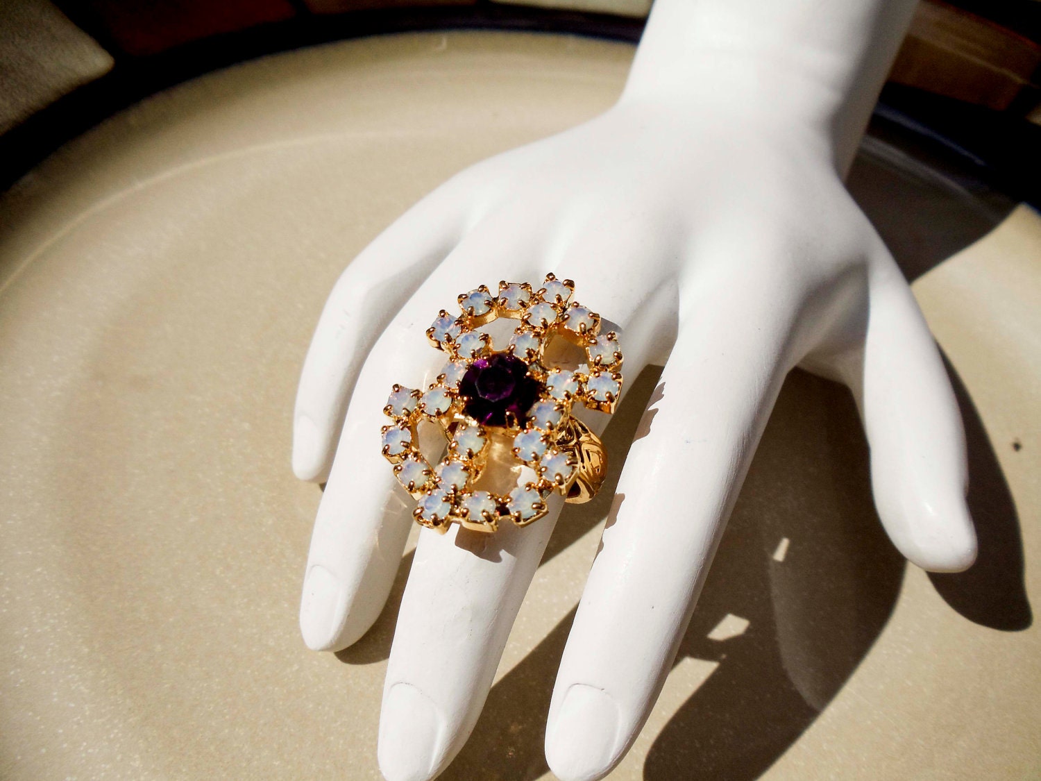 Vintage Sarah Coventry Gold ring with purple and white stones