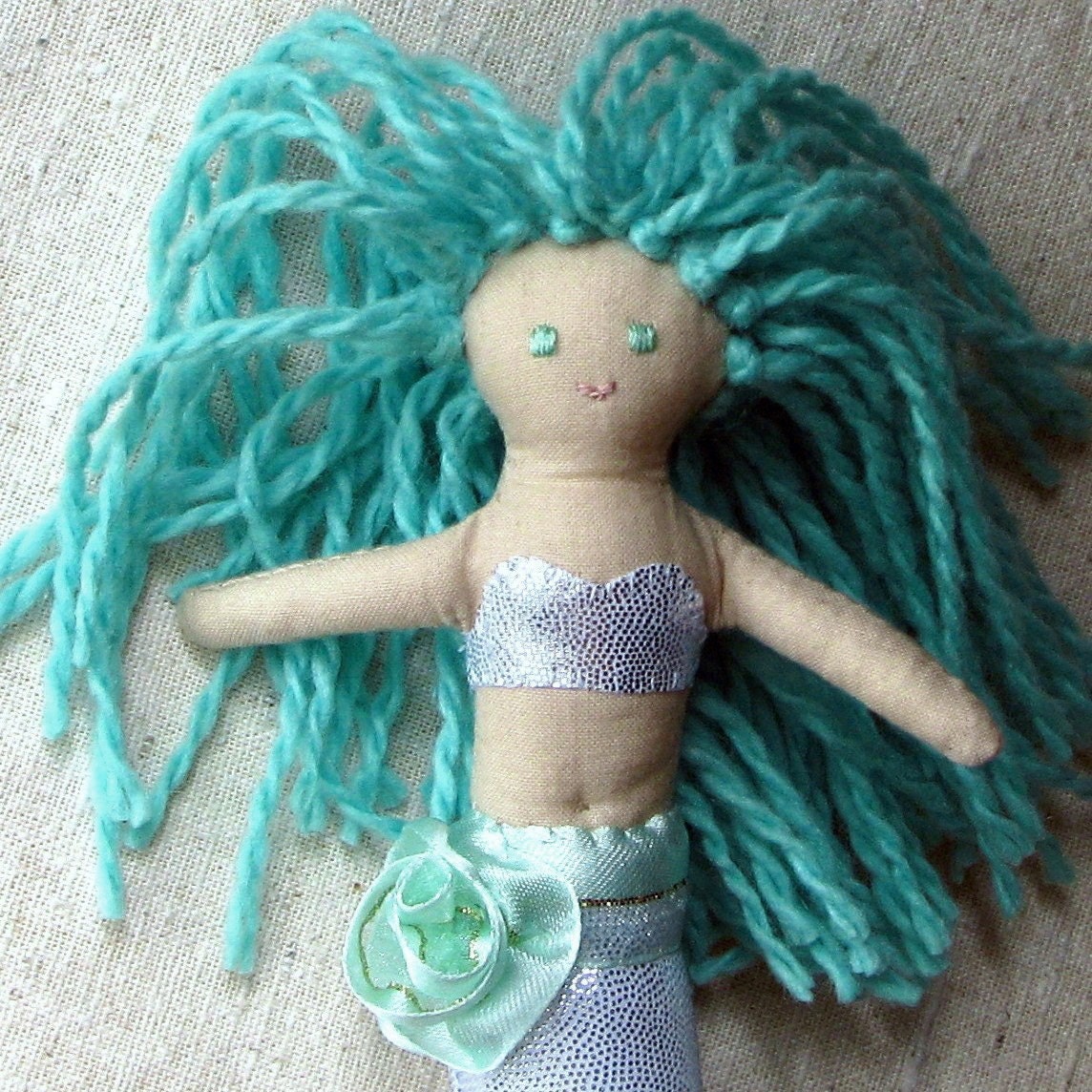 Mermaid doll, sparkly silver fishtail and aqua green hair