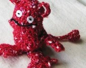 Red monster, crocheted from soft speckled red yarn, a little over 5 inches tall