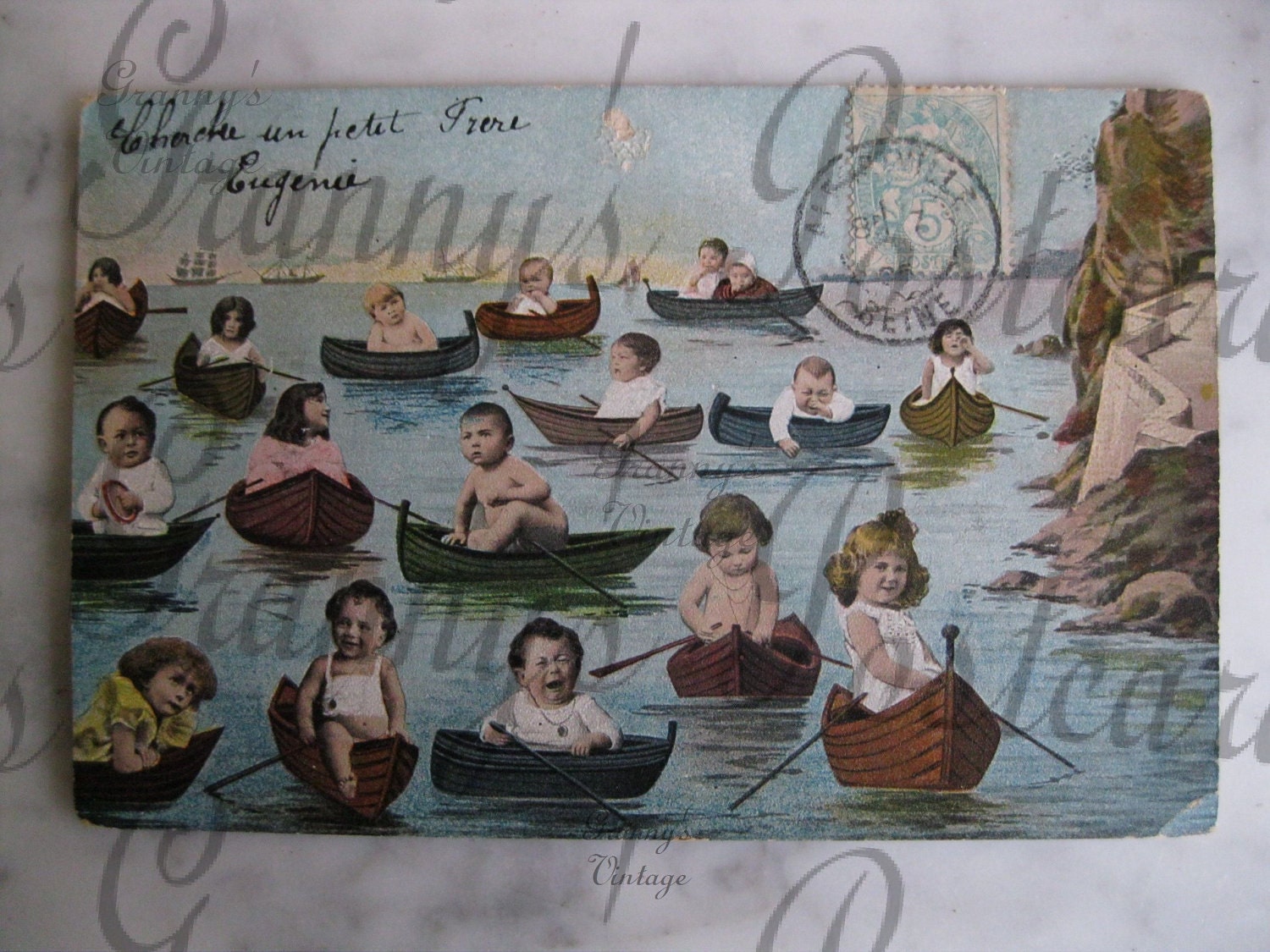 Original Antique French postcard. Multiple babies.In small boats. Collectors item. You must see. Early 1900
