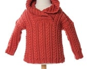 THE ALEXANDER. A terra cotta unisex cable sweater with hoodie fit for a 3 to 6 month old.