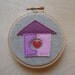 HOME embroidered wall art in carnation