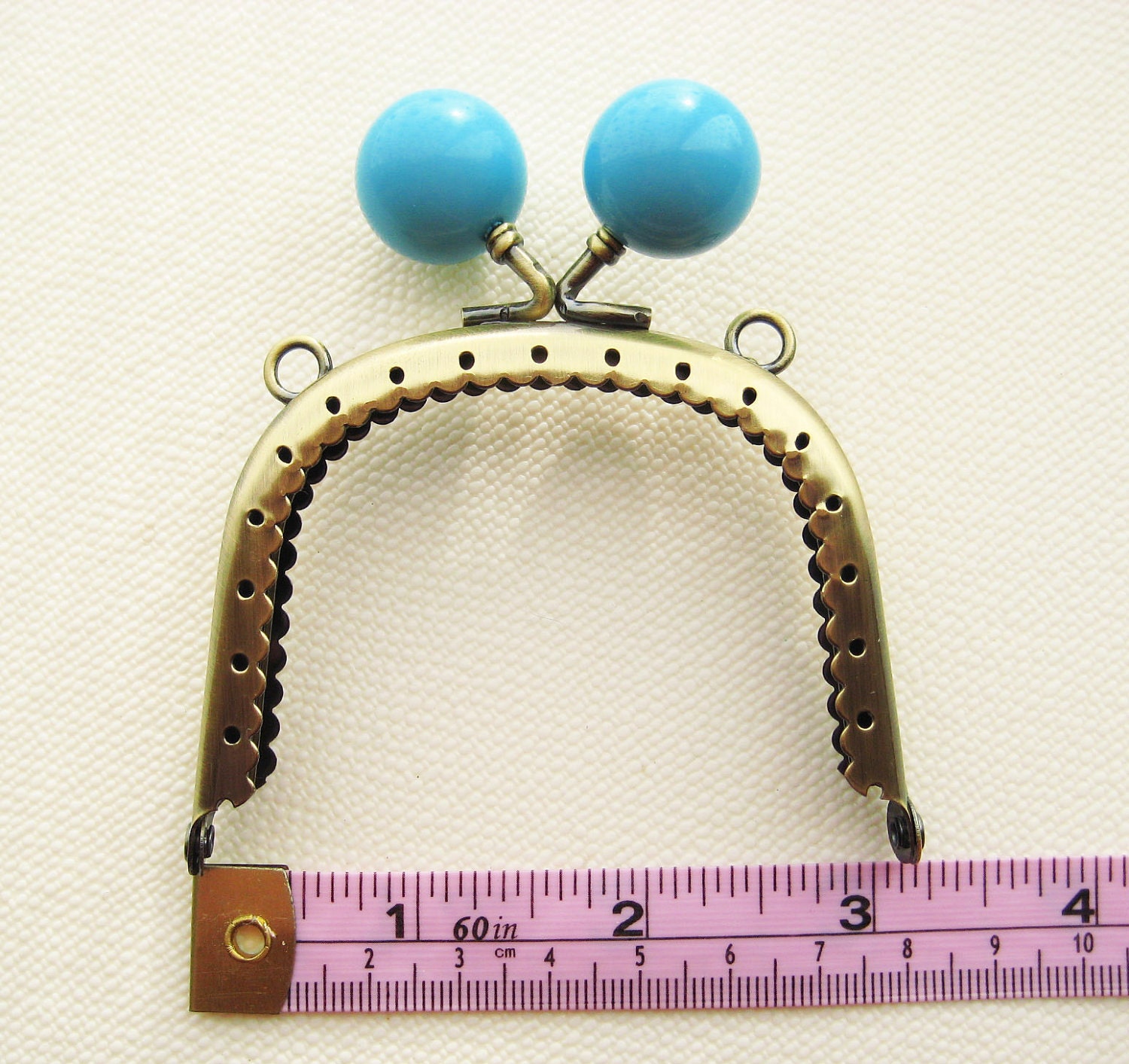 8cm/3 inch Antique Brass purse frame with large baby blue kiss lock head, sew holes, and double loops