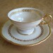 Vintage Castleton Laurel Footed Teacup and Saucer...1960s Ivory with Gilding
