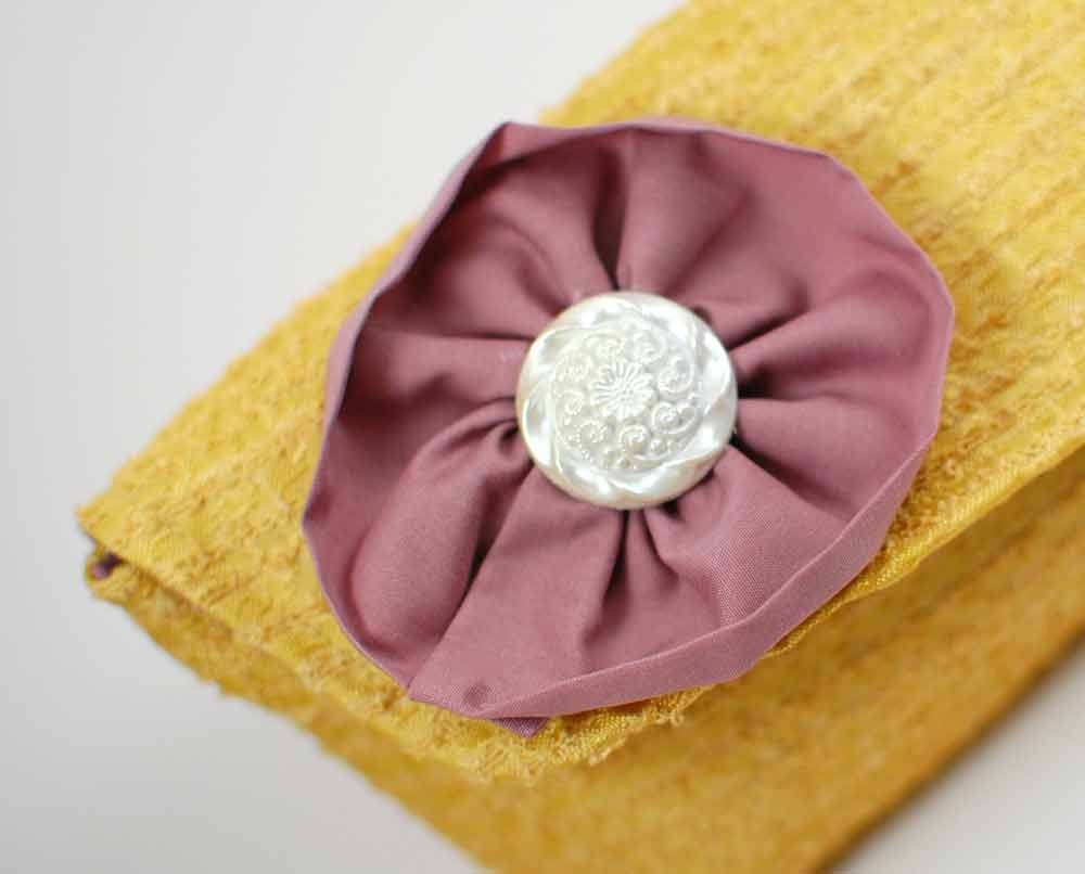 50 percent off sale- Clutch handbag- gold upholstery lavender yoyo white button