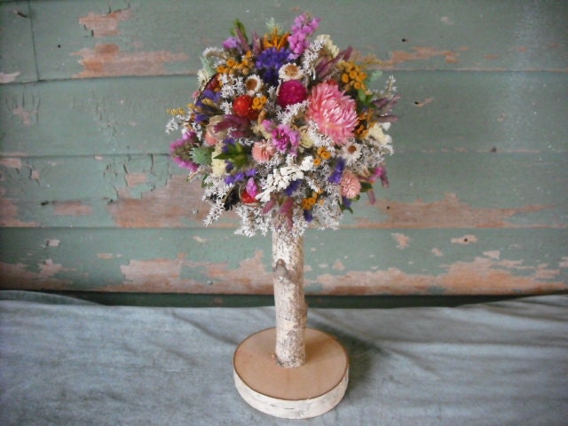 Dried flower topiary with birch log stem in spring or summer colors. A nice wedding centerpiece.
