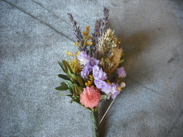 Boutonneire made with pastle dried flowers and herbs, custom made in your colors.