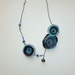 One of a kind hand made flower ncklace from silk and glass beads on a black chain