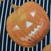 Halloween Pumpkin Fabric Carved Pumpkin Faces with Black and White Stripe Background 1/2 Yard