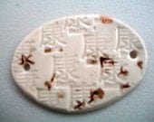 Ceramic Badge with the Asian Symbol for Health